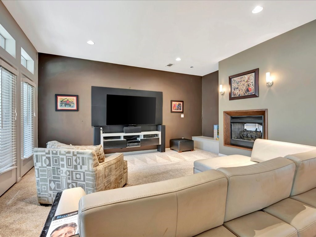 3418 St George Circle Nacogdoches, TX 75965 - Photo 15 of 50 a living room with furniture and a flat screen tv