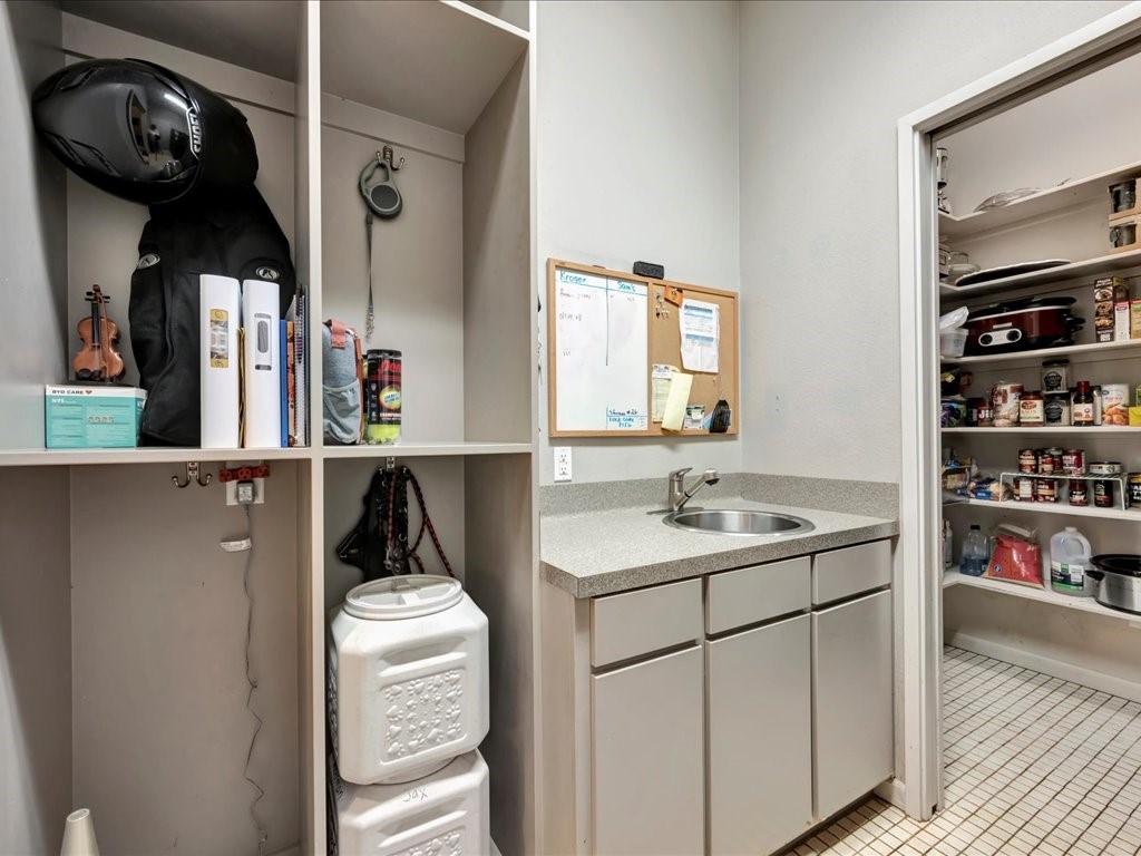 3418 St George Circle Nacogdoches, TX 75965 - Photo 24 of 50 a kitchen with a sink a stove and cabinets