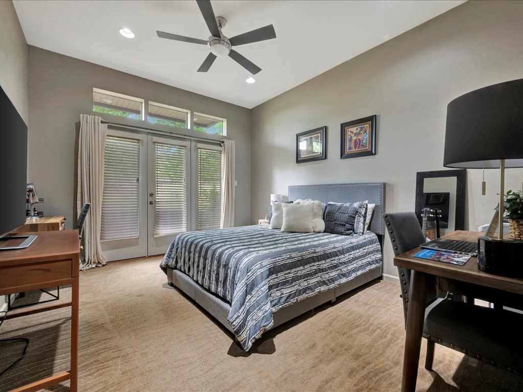 3418 St George Circle Nacogdoches, TX 75965 - Photo 25 of 50 a bedroom with a bed and a flat screen tv