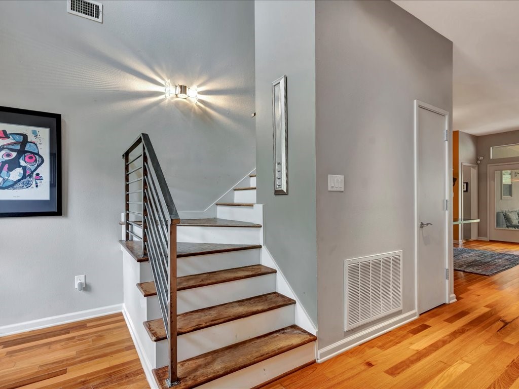 3418 St George Circle Nacogdoches, TX 75965 - Photo 27 of 50 a view of staircase with white walls and a window