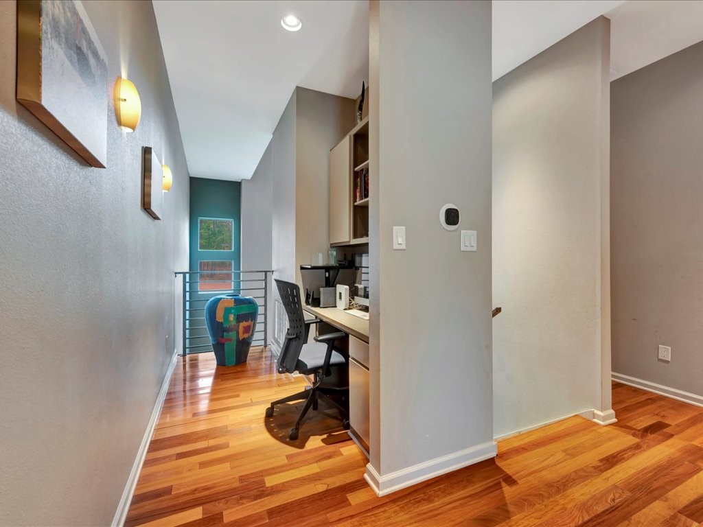 3418 St George Circle Nacogdoches, TX 75965 - Photo 29 of 50 a room with wooden floor and furniture