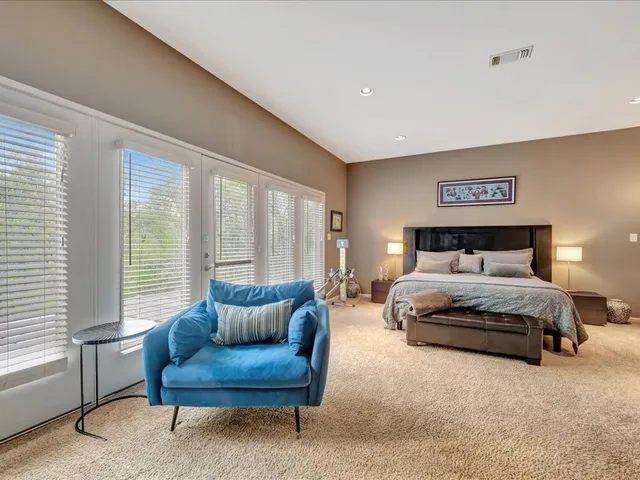 a bedroom with a bed and a couch