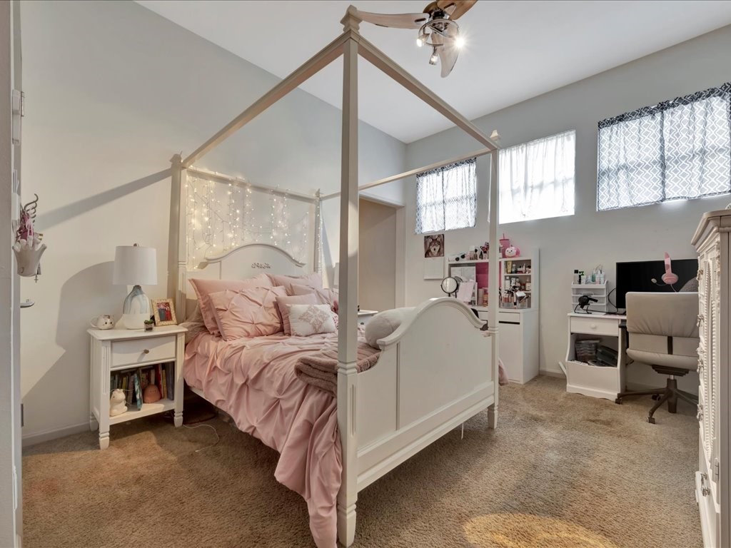 3418 St George Circle Nacogdoches, TX 75965 - Photo 40 of 50 a bedroom with a bed and a chandelier