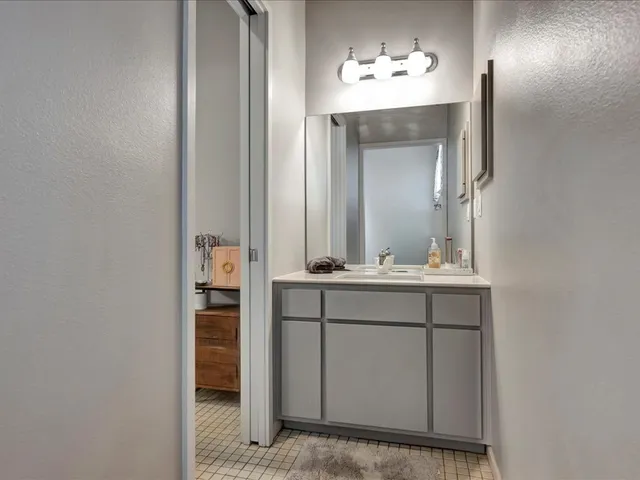a bathroom with a sink and a mirror