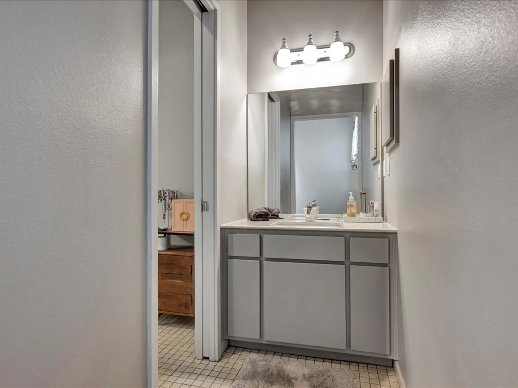 3418 St George Circle Nacogdoches, TX 75965 - Photo 41 of 50 a bathroom with a sink and a mirror
