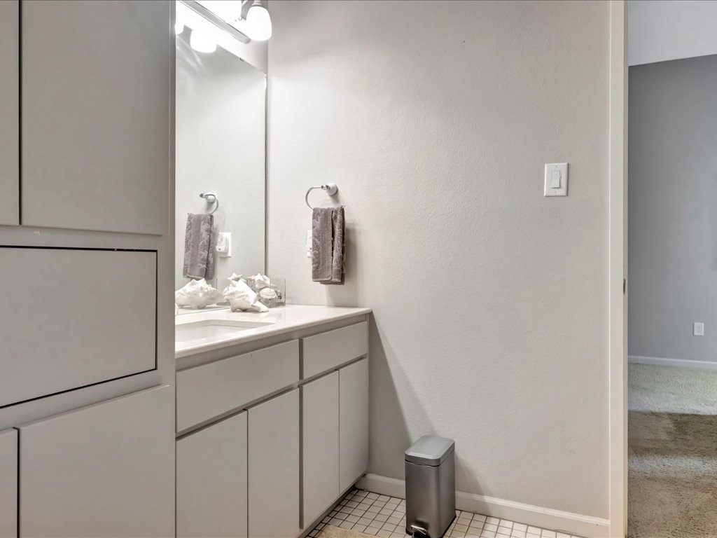 3418 St George Circle Nacogdoches, TX 75965 - Photo 43 of 50 a bathroom with a sink and mirror