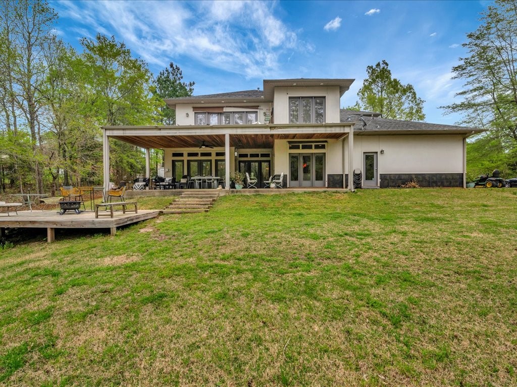 3418 St George Circle Nacogdoches, TX 75965 - Photo 50 of 50 a view of a yard with plants and large tree
