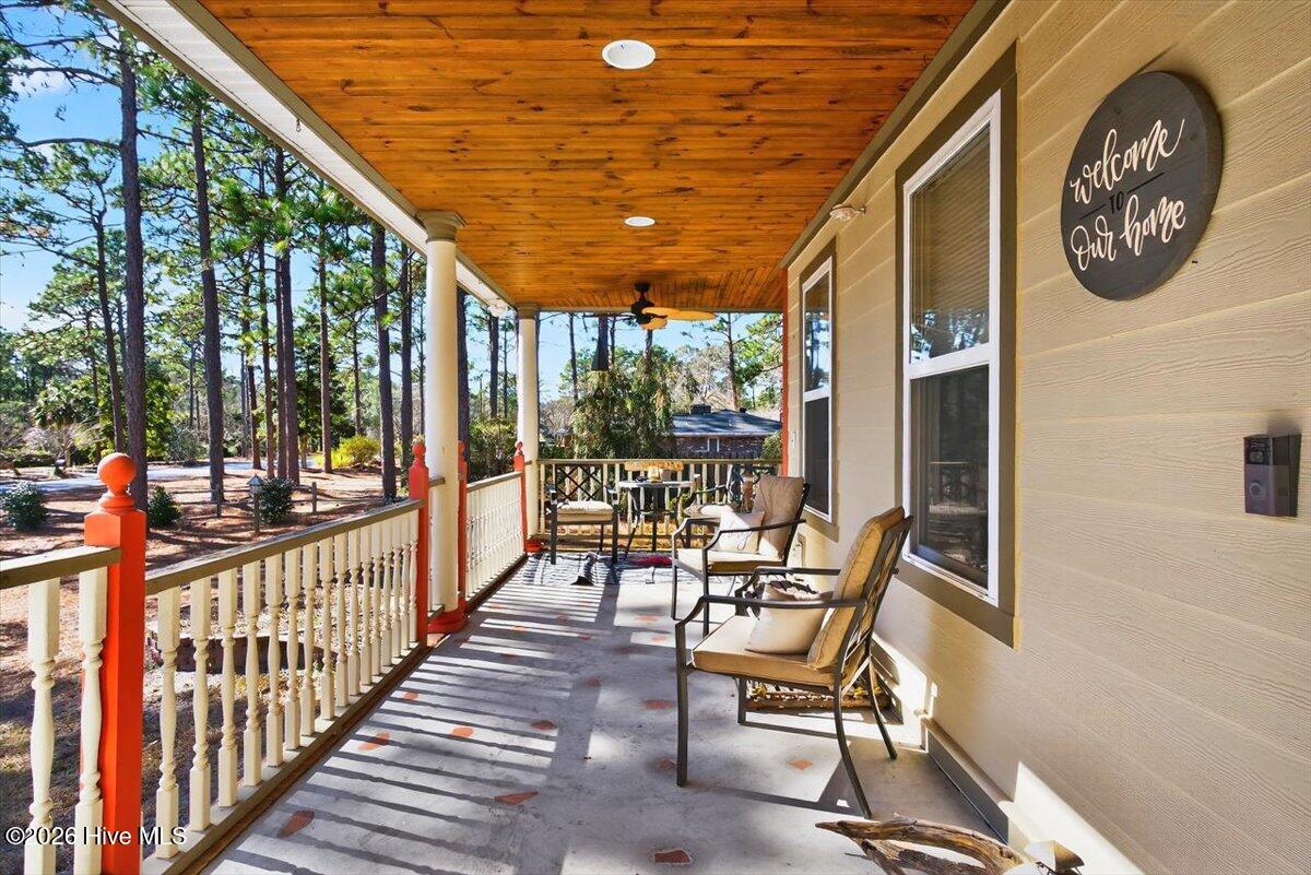 18 Brierwood Road Southwest Shallotte, NC 28470 - Photo 8 of 70 Charming wraparound front porch—perfect for relaxing and enjoying quiet coastal Carolina mornings.