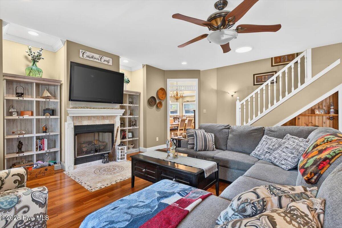 18 Brierwood Road Southwest Shallotte, NC 28470 - Photo 10 of 70 Spacious living room with vaulted ceilings, gas fireplace, and abundant natural light—ideal for everyday living and entertaining.
