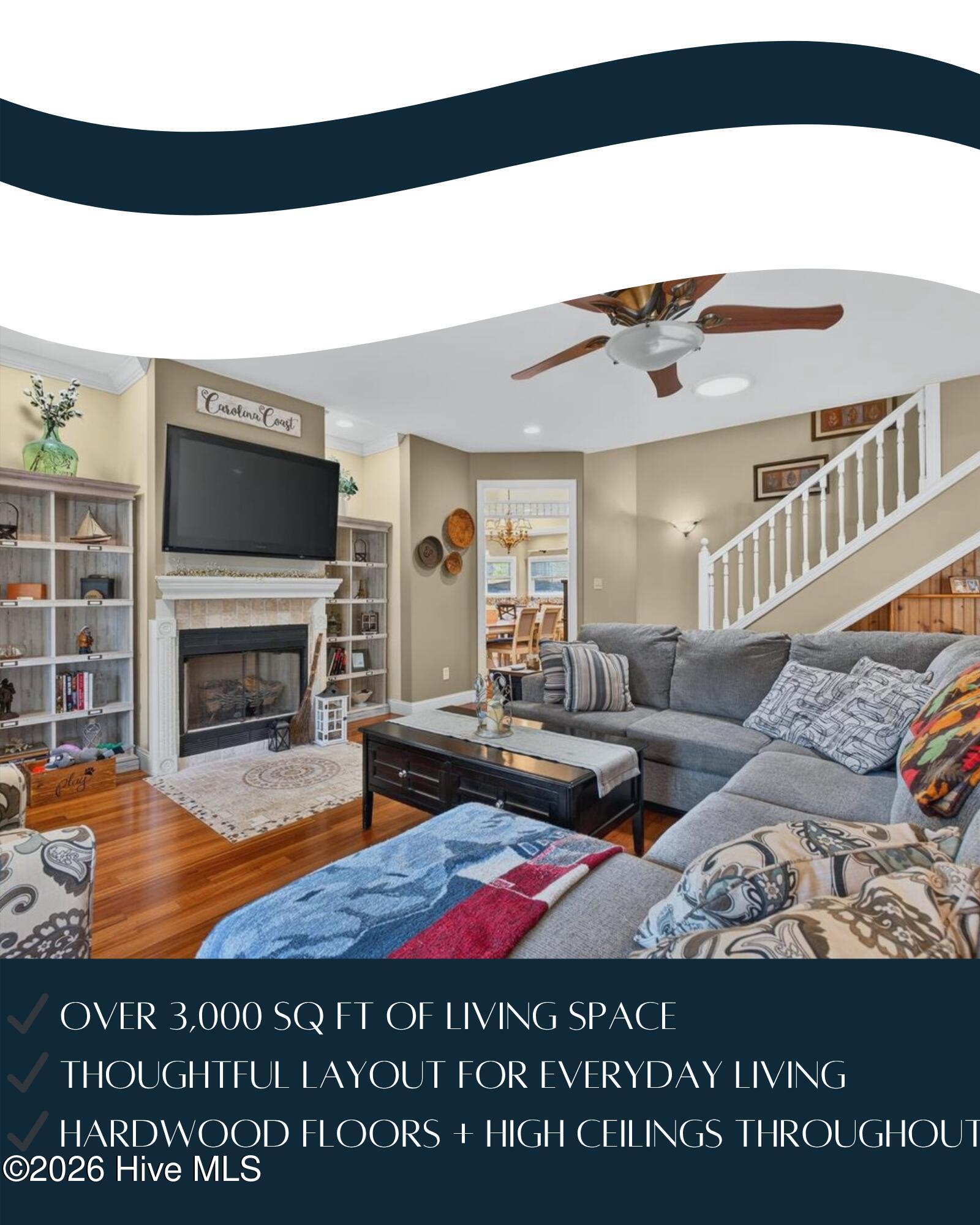 18 Brierwood Road Southwest Shallotte, NC 28470 - Photo 12 of 70 Comfortable main living area featuring hardwood floors, ceiling fan, and open flow into dining and kitchen spaces.