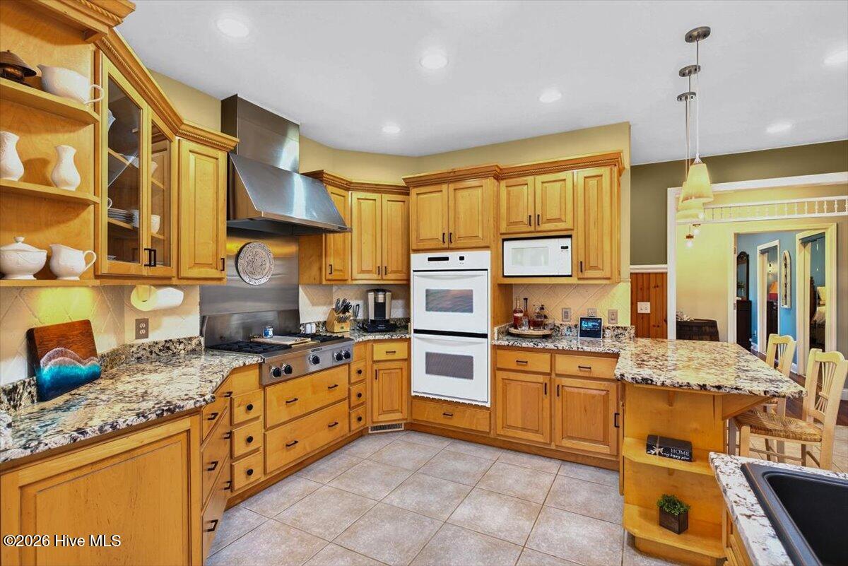 18 Brierwood Road Southwest Shallotte, NC 28470 - Photo 17 of 70 Large eat-in kitchen with abundant cabinetry, granite countertops, and plenty of prep space for home chefs.