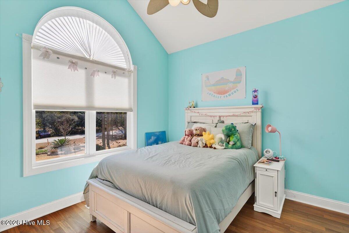 18 Brierwood Road Southwest Shallotte, NC 28470 - Photo 31 of 70 Light-filled bedroom with charming window design and cozy coastal feel.