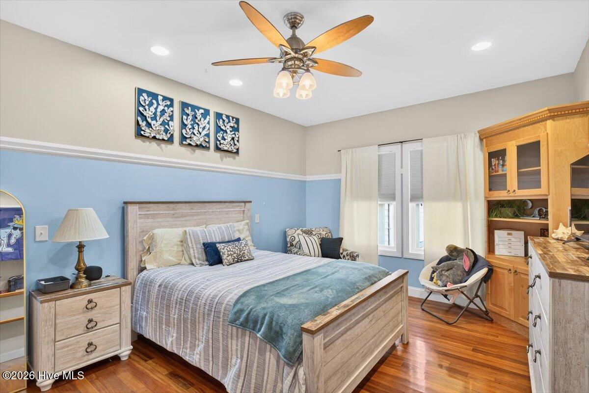 18 Brierwood Road Southwest Shallotte, NC 28470 - Photo 32 of 70 Generous bedroom with tray ceiling, hardwood floors, and ample natural light.