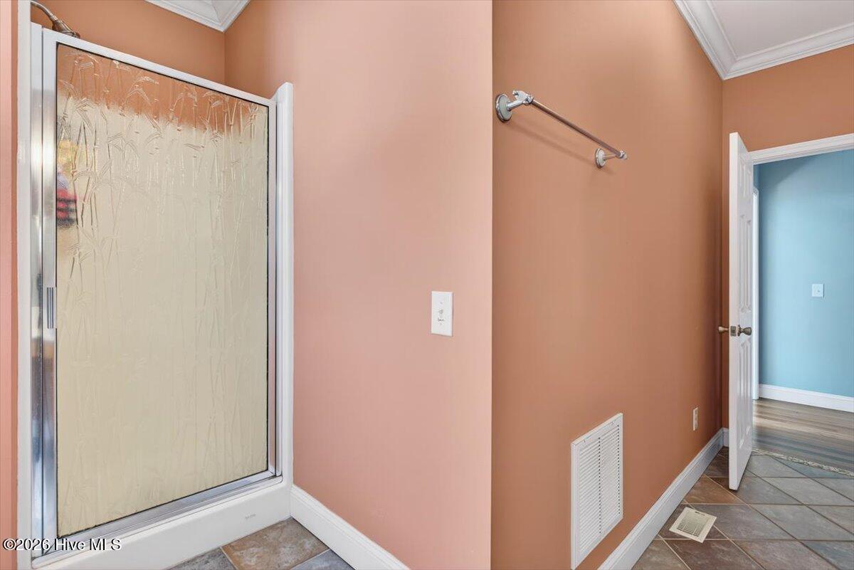18 Brierwood Road Southwest Shallotte, NC 28470 - Photo 35 of 70 Walk-in shower with tile surround and functional layout in primary bath.