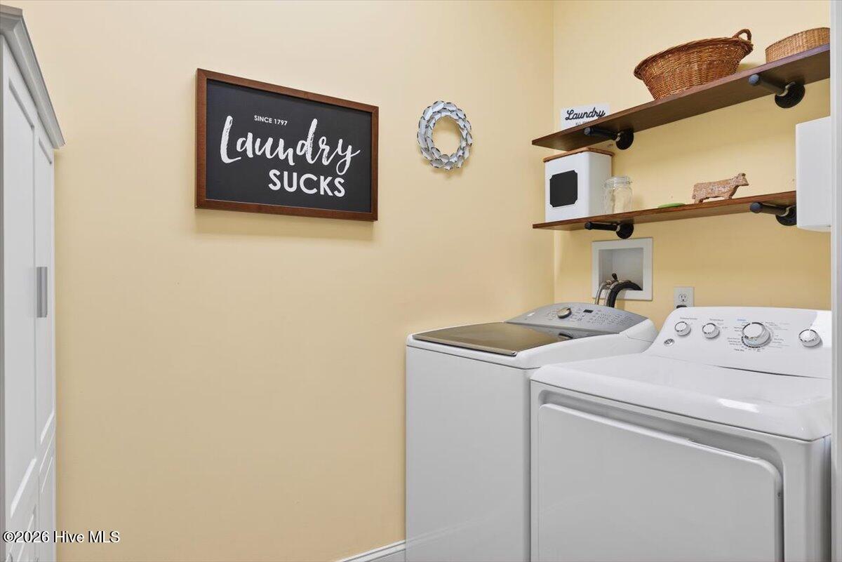 18 Brierwood Road Southwest Shallotte, NC 28470 - Photo 37 of 70 Dedicated laundry room with washer/dryer and additional storage space for convenience.