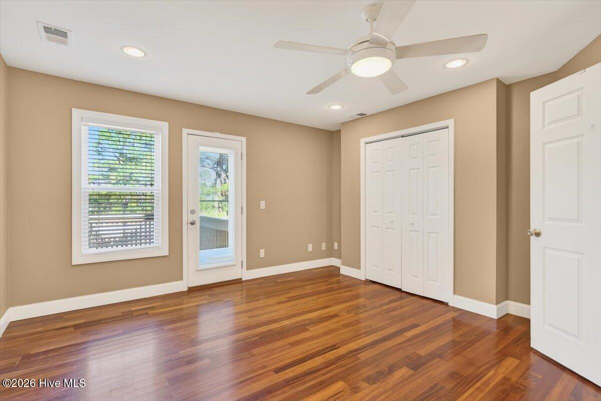 18 Brierwood Road Southwest Shallotte, NC 28470 - Photo 39 of 70 Spacious area with hardwood floors and neutral tones ready for customization.