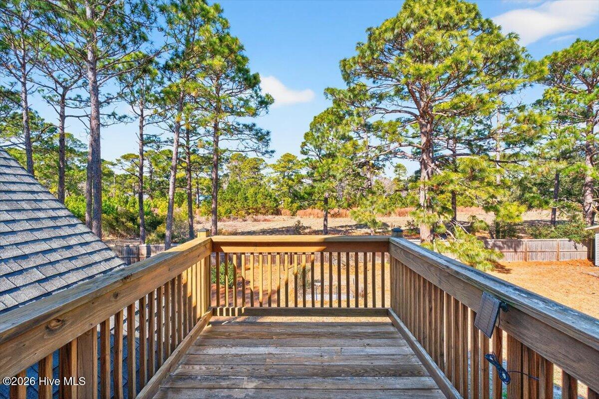 18 Brierwood Road Southwest Shallotte, NC 28470 - Photo 40 of 70 Expansive rear deck overlooking private backyard—ideal for outdoor entertaining.