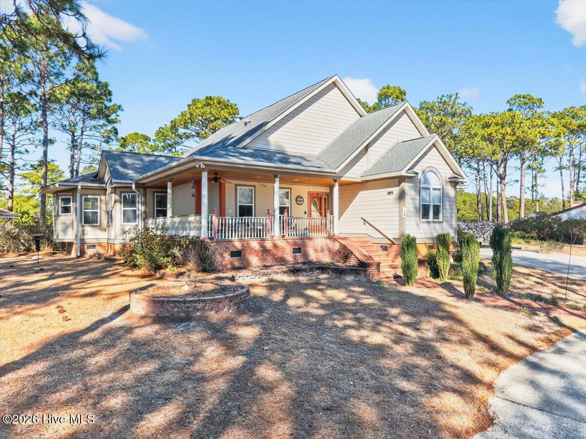 18 Brierwood Road Southwest Shallotte, NC 28470 - Photo 52 of 70 Another view of the home’s charming curb appeal and inviting wraparound porch.