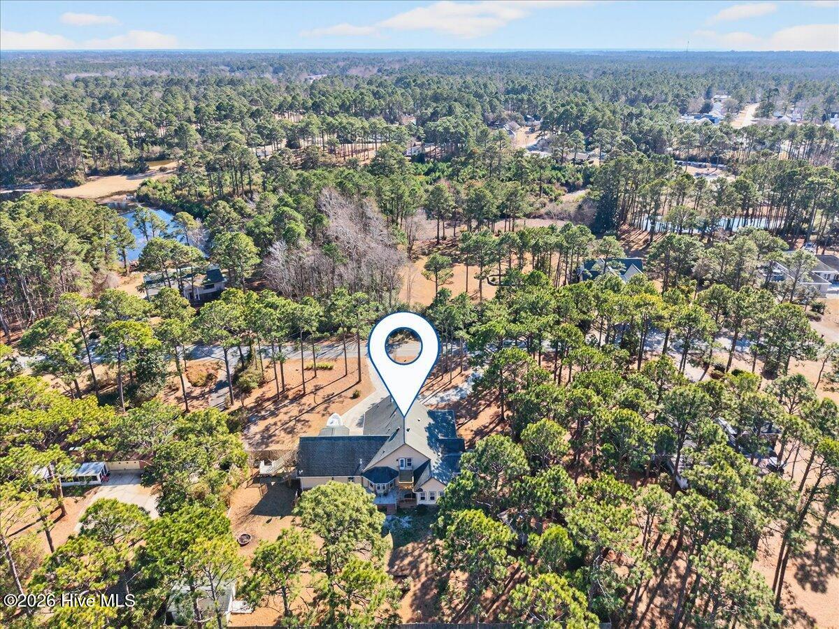 18 Brierwood Road Southwest Shallotte, NC 28470 - Photo 53 of 61 Aerial view of 18 Brierwood surrounded by lush landscaping and trees for added privacy.