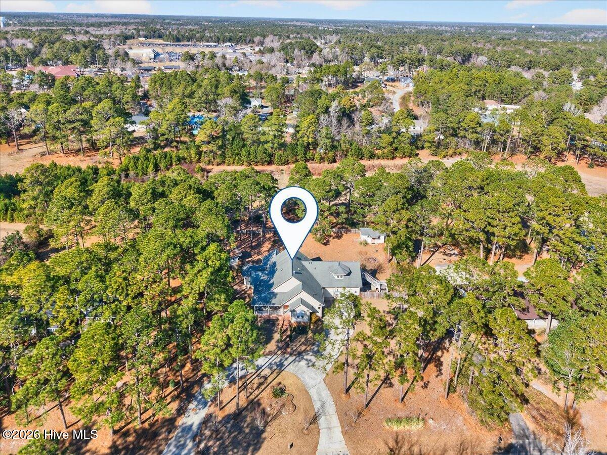 18 Brierwood Road Southwest Shallotte, NC 28470 - Photo 54 of 61 Aerial view of 18 Brierwood surrounded by lush landscaping and trees for added privacy.