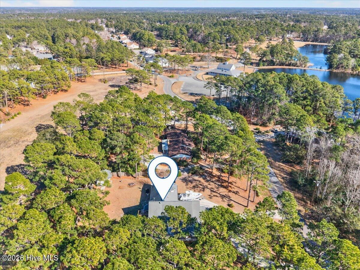 18 Brierwood Road Southwest Shallotte, NC 28470 - Photo 55 of 61 Aerial view of 18 Brierwood surrounded by lush landscaping and trees for added privacy.