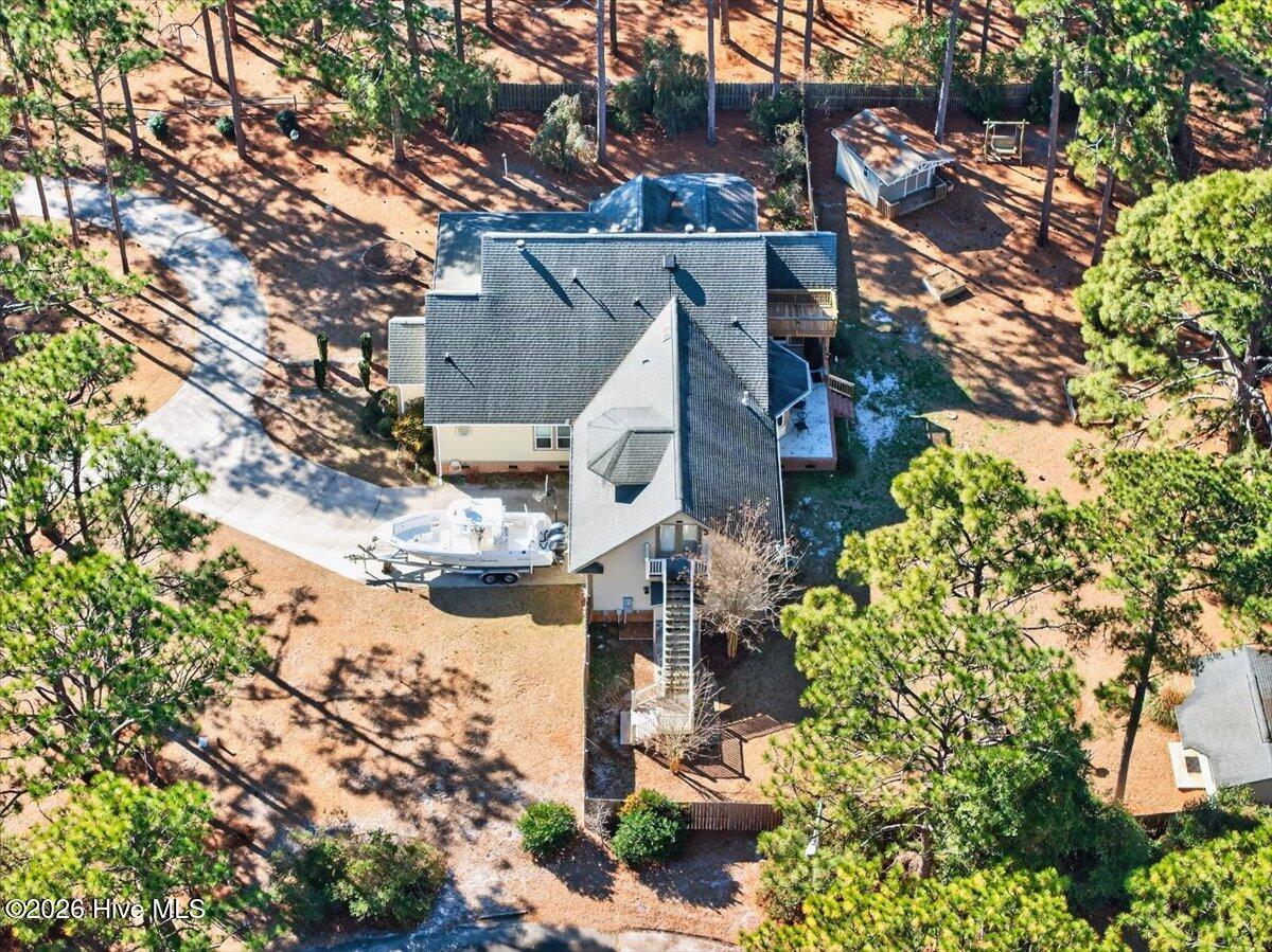 18 Brierwood Road Southwest Shallotte, NC 28470 - Photo 59 of 70 Aerial view highlighting the home’s positioning on a large, private lot surrounded by mature trees.