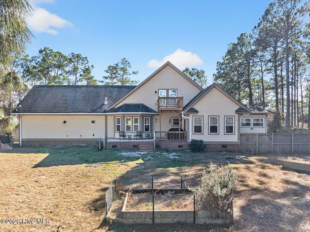 18 Brierwood Road Southwest Shallotte, NC 28470 - Photo 4 of 70 Expansive back yard and full view of this well-maintained Shallotte home offering privacy and space just minutes from the coast.