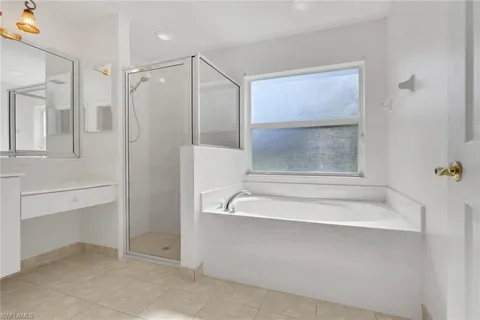 a bathroom with a tub and shower