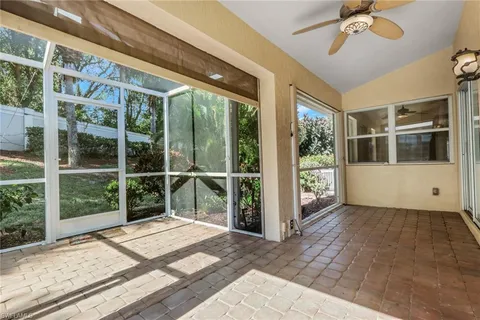 a view of front door and porch with wooden floor