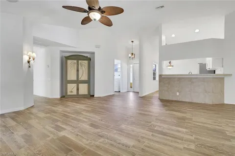 a view of a kitchen with a sink and a window