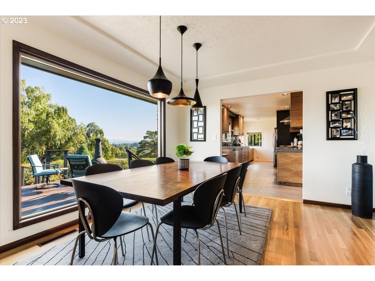 715 Southwest Walters Drive Gresham, OR 97080 - Photo 13 of 48 a view of a dining room with furniture window and wooden floor