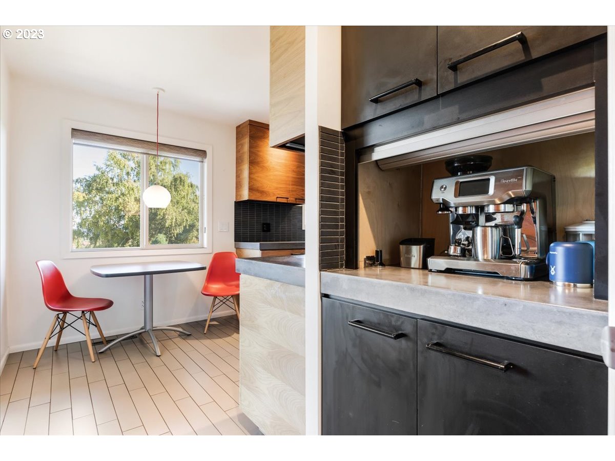 715 Southwest Walters Drive Gresham, OR 97080 - Photo 22 of 48 a living room with kitchen island furniture and a wooden floor