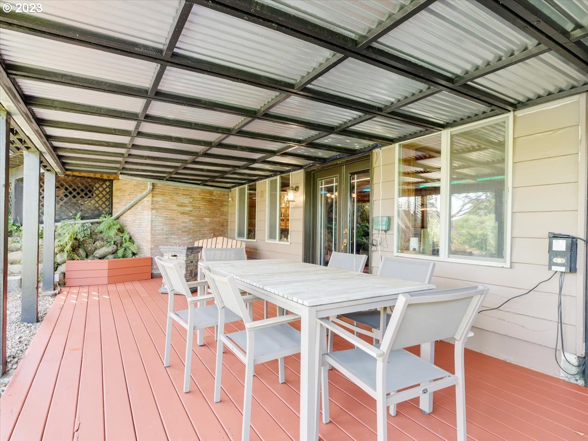 715 Southwest Walters Drive Gresham, OR 97080 - Photo 40 of 48 a view of a dining room with furniture large windows and wooden floor