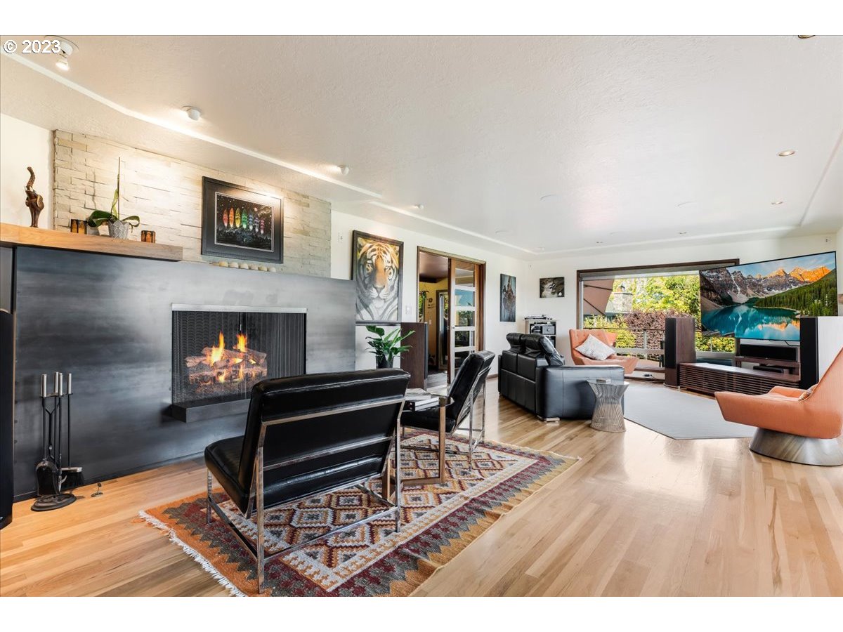 715 Southwest Walters Drive Gresham, OR 97080 - Photo 8 of 48 a living room with furniture and a fireplace