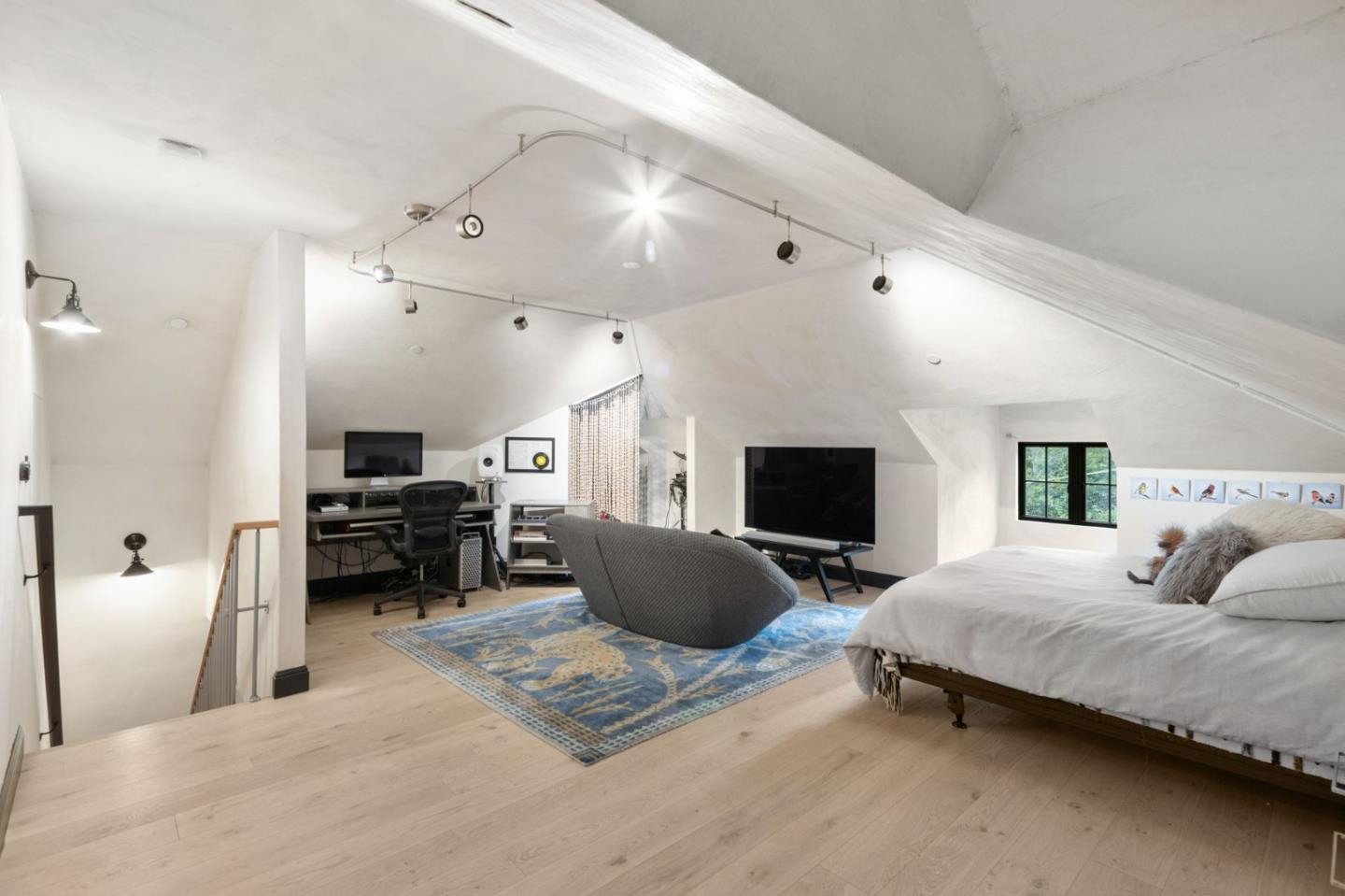 13321 La Paloma Road Los Altos Hills, CA 94022 - Photo 16 of 36 a living room with furniture a flat screen tv and a couch