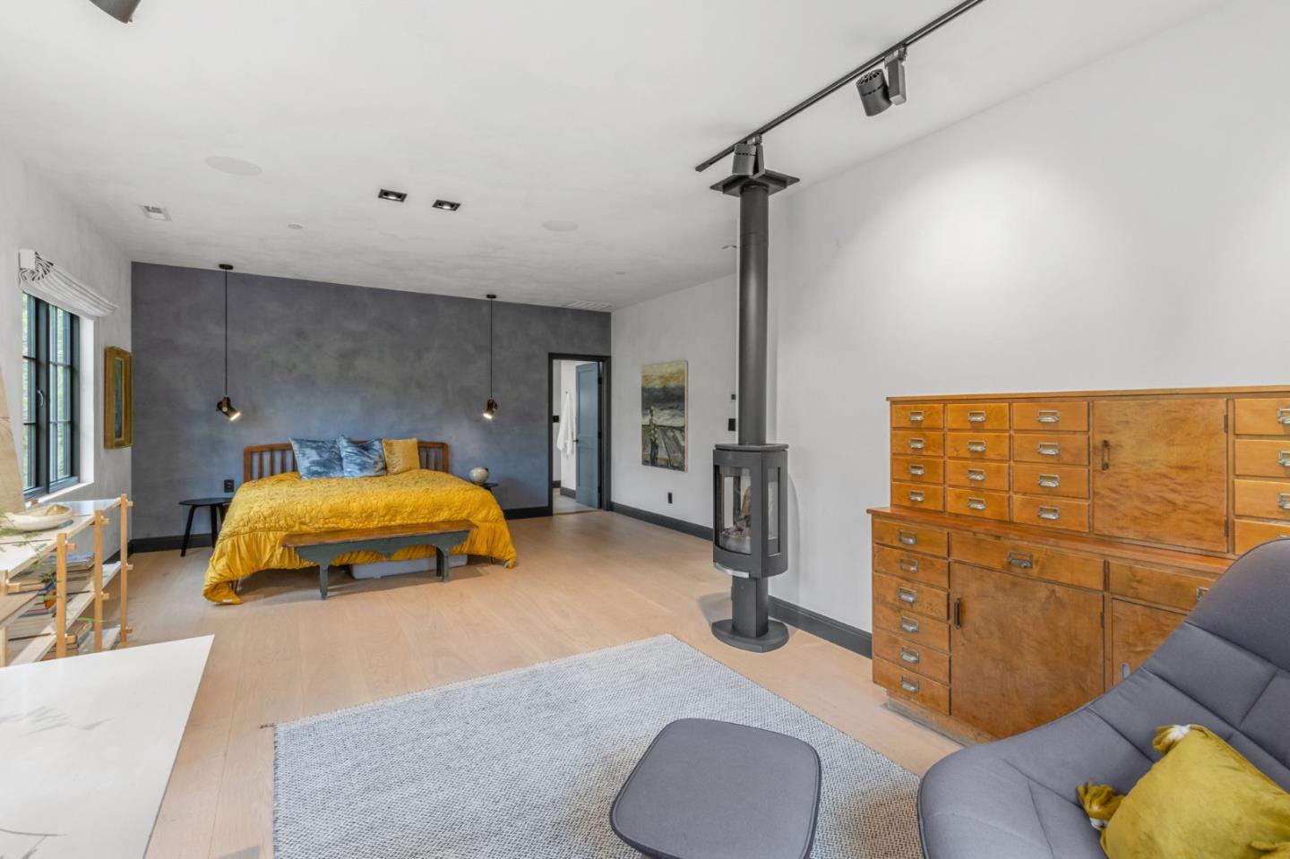 13321 La Paloma Road Los Altos Hills, CA 94022 - Photo 19 of 36 a bedroom with a bed and ceiling fan