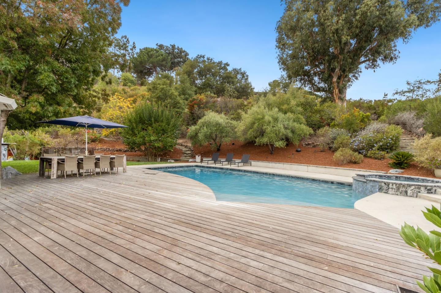 13321 La Paloma Road Los Altos Hills, CA 94022 - Photo 29 of 36 a view of a house with pool and a yard