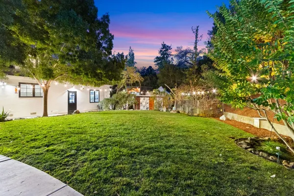 a view of a house with a yard