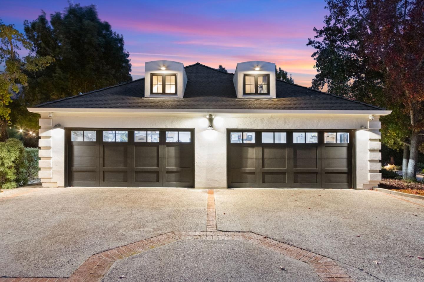 13321 La Paloma Road Los Altos Hills, CA 94022 - Photo 5 of 36 a view of a white house with large windows and a large parking space