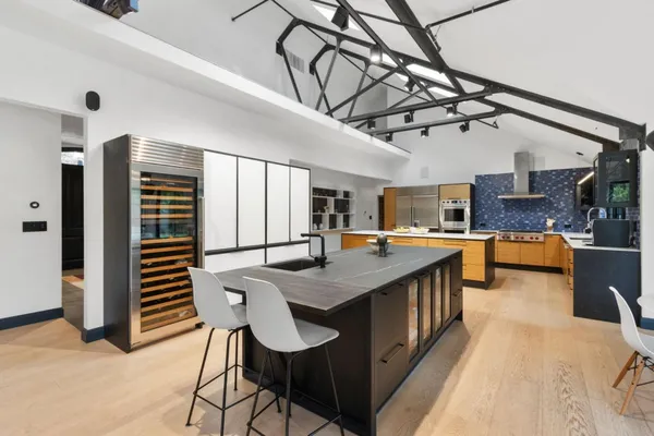 a kitchen with stainless steel appliances granite countertop a sink and cabinets
