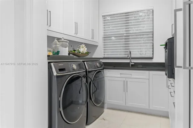 a utility room with cabinets