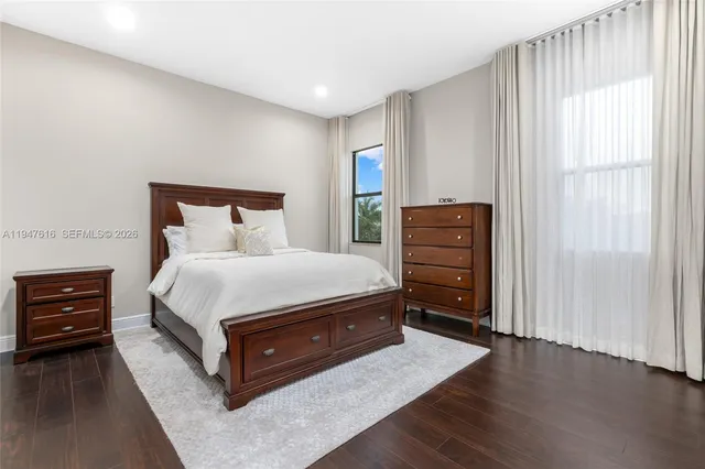 a bedroom with a bed and furniture