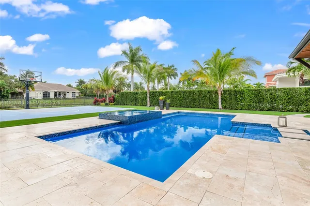 a view of swimming pool with outdoor seating