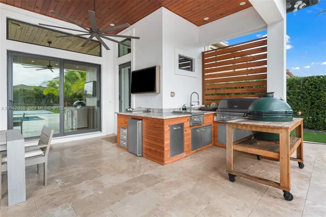 a kitchen with a stove a sink and a refrigerator