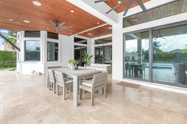 a dining area with furniture and outdoor view