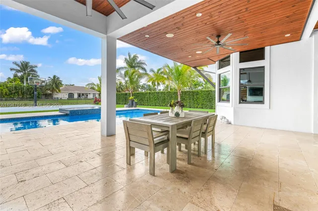 a view of a patio with a backyard