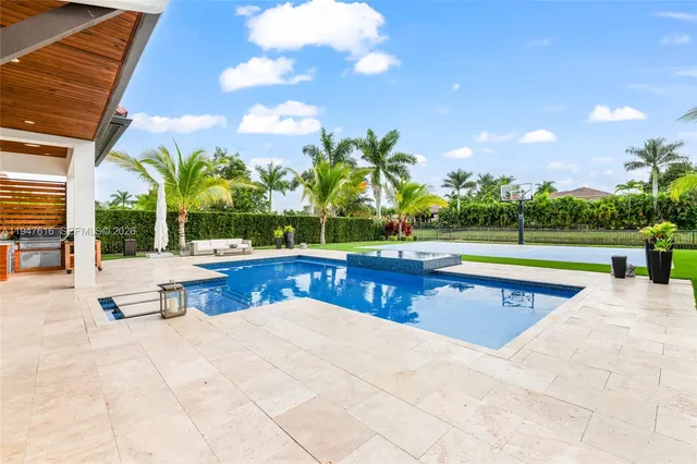 a view of outdoor space with swimming pool and furniture