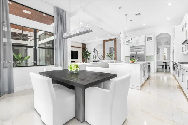 a view of a dining room with furniture window and outside view