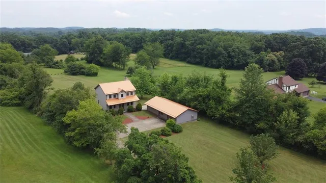 an aerial view of a house with a garden