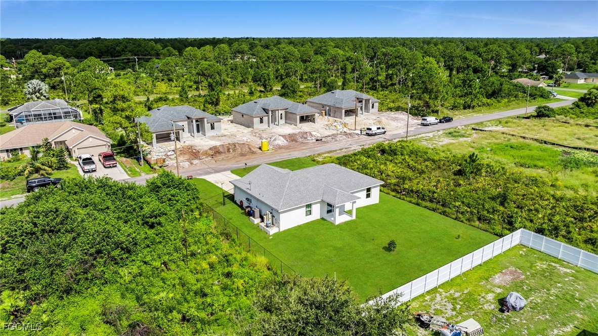 767 Roma Avenue South Lehigh Acres, FL 33974 - Photo 15 of 34 a aerial view of a house with garden space and street view